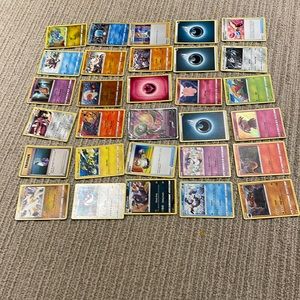 30 Pokémon cards. One V card and three holos.